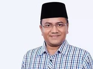 Dr H Maulana.